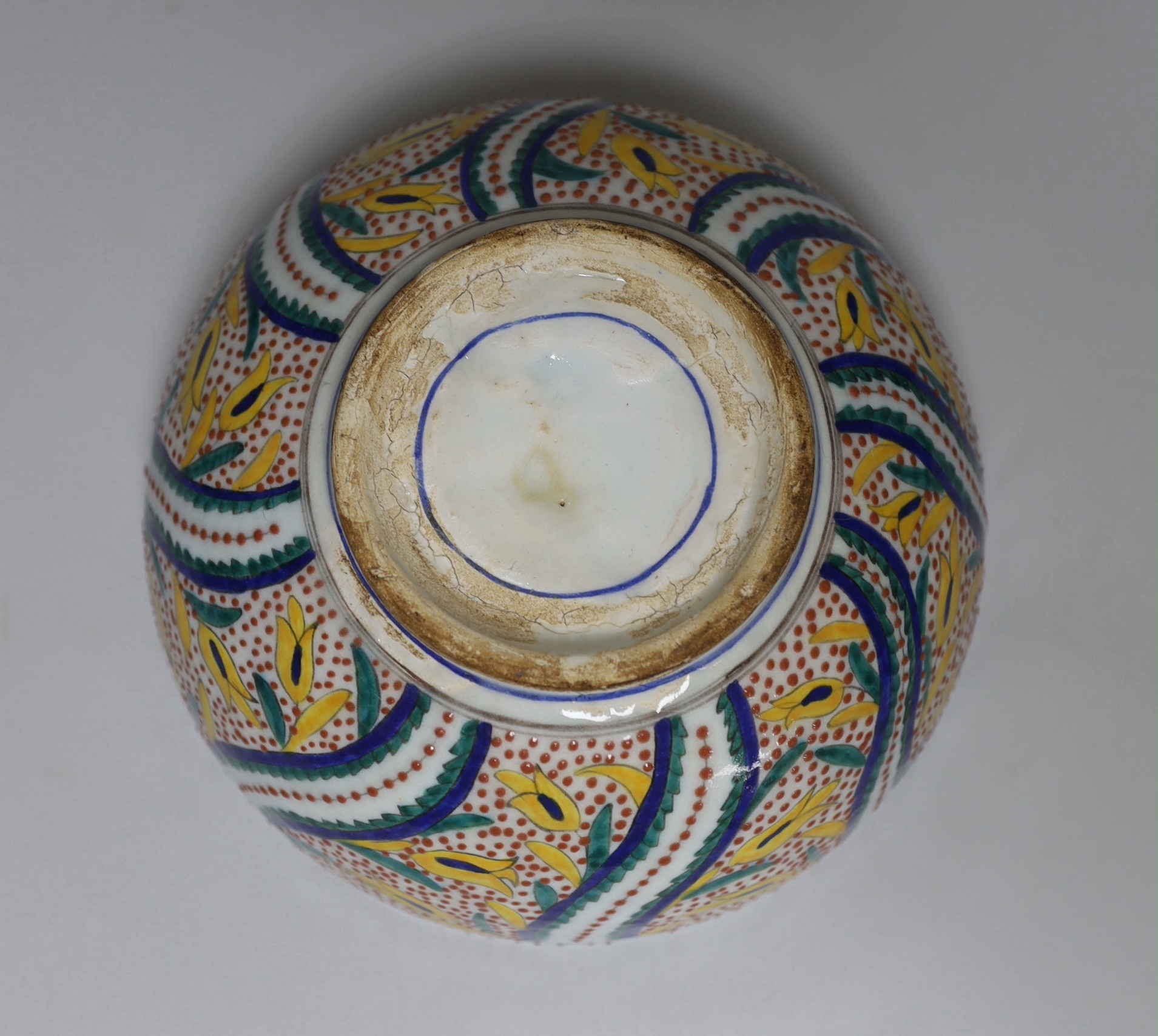 A Turkish Kutahya bowl hand painted with stylised flowers, 19cm in diameter